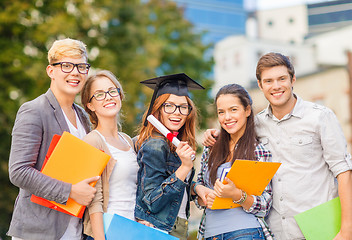 Image showing students or teenagers with files and diploma