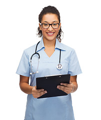 Image showing smiling female african american doctor or nurse