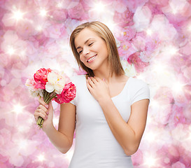 Image showing smiling woman with bouquet of flowers