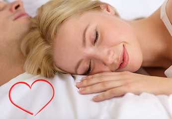 Image showing happy couple sleeping in bed