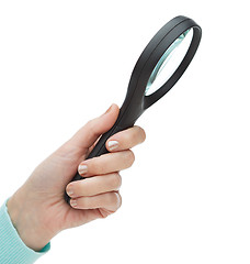 Image showing woman hand holding magnifying glass