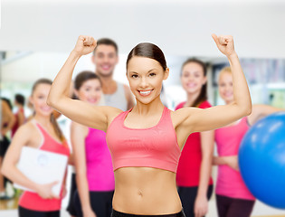 Image showing personal trainer with group in gym