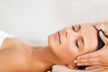 Image showing beautiful woman in spa salon having facial