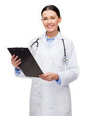 Image showing smiling female doctor with clipboard