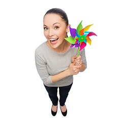 Image showing smiling asian woman with windmill