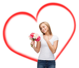 Image showing smiling woman with bouquet of flowers