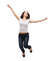 Image showing teenage girl in white blank t-shirt jumping