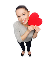 Image showing smiling asian woman with red heart
