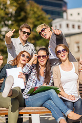 Image showing students with books, notebooks, files and folders