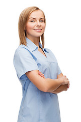 Image showing smiling female doctor or nurse