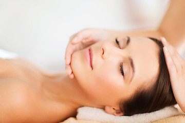 Image showing beautiful woman in spa salon having facial