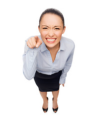 Image showing angry businesswoman pointing finger at you