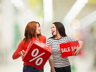 Image showing smiling teenage girl with percent and sale sign