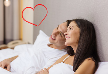 Image showing happy couple dreaming in bed