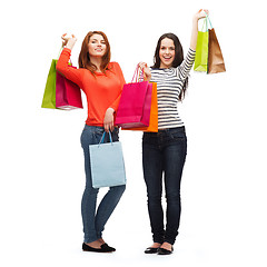 Image showing two smiling teenage girls with shopping bags