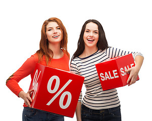 Image showing smiling teenage girl with percent and sale sign