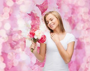 Image showing smiling woman with bouquet of flowers