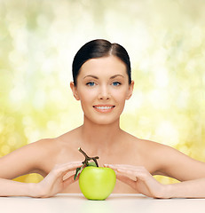 Image showing beautiful woman with green apple