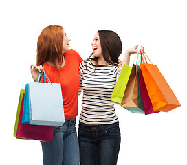 Image showing two smiling teenage girls with shopping bags