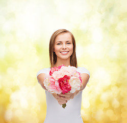 Image showing smiling woman with bouquet of flowers