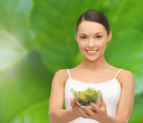 Image showing healthy woman holding bowl with salad