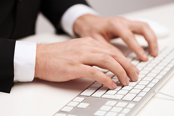 Image showing businessman working with keyboard