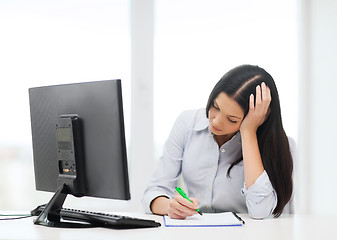 Image showing tired businesswoman or student