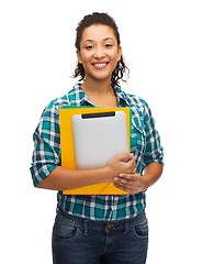 Image showing smiling black student with folders and tablet pc