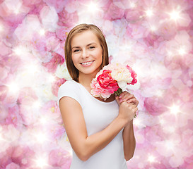 Image showing smiling woman with bouquet of flowers