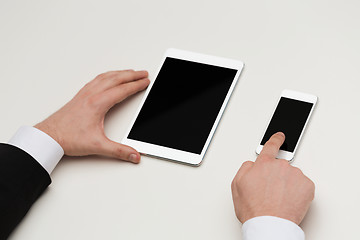 Image showing businessman working with table pc and smartphone