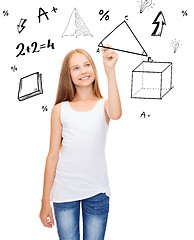 Image showing smiling girl in blank white shirt drawing triangle