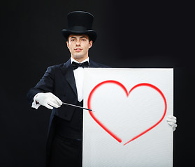 Image showing magician in top hat with magic wand showing trick