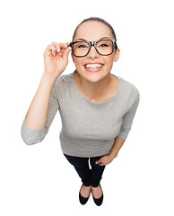 Image showing asian woman in touching eyeglasses