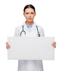 Image showing female doctor with stethoscope and white board