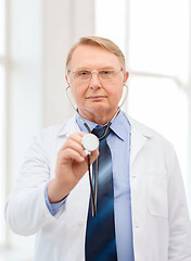 Image showing calm doctor or professor with stethoscope