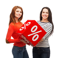 Image showing two smiling teenage girl with percent sign on box