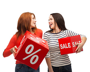 Image showing smiling teenage girl with percent and sale sign