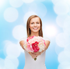 Image showing smiling woman with bouquet of flowers