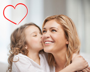 Image showing smiling mother and daughter hugging