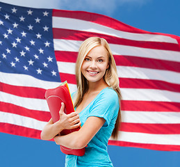 Image showing smiling student with folders