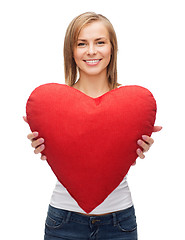 Image showing smiling woman in white t-shirt with heart