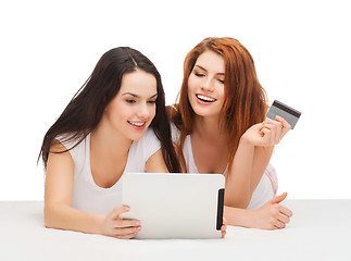 Image showing smiling teenagers with tablet pc and credit card