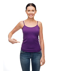 Image showing woman in blank purple tank top pointing at herself