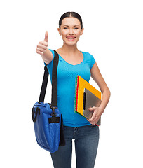 Image showing smiling student with bag, folders and tablet pc
