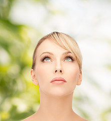 Image showing beautiful woman looking up