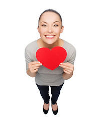 Image showing smiling asian woman with red heart