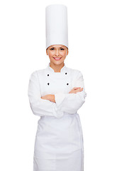 Image showing smiling female chef with crossed arms