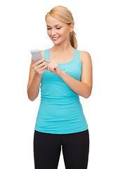 Image showing sporty woman with smartphone