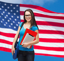 Image showing smiling student with bag, folders and tablet pc