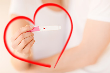 Image showing woman and man hands with pregnancy test